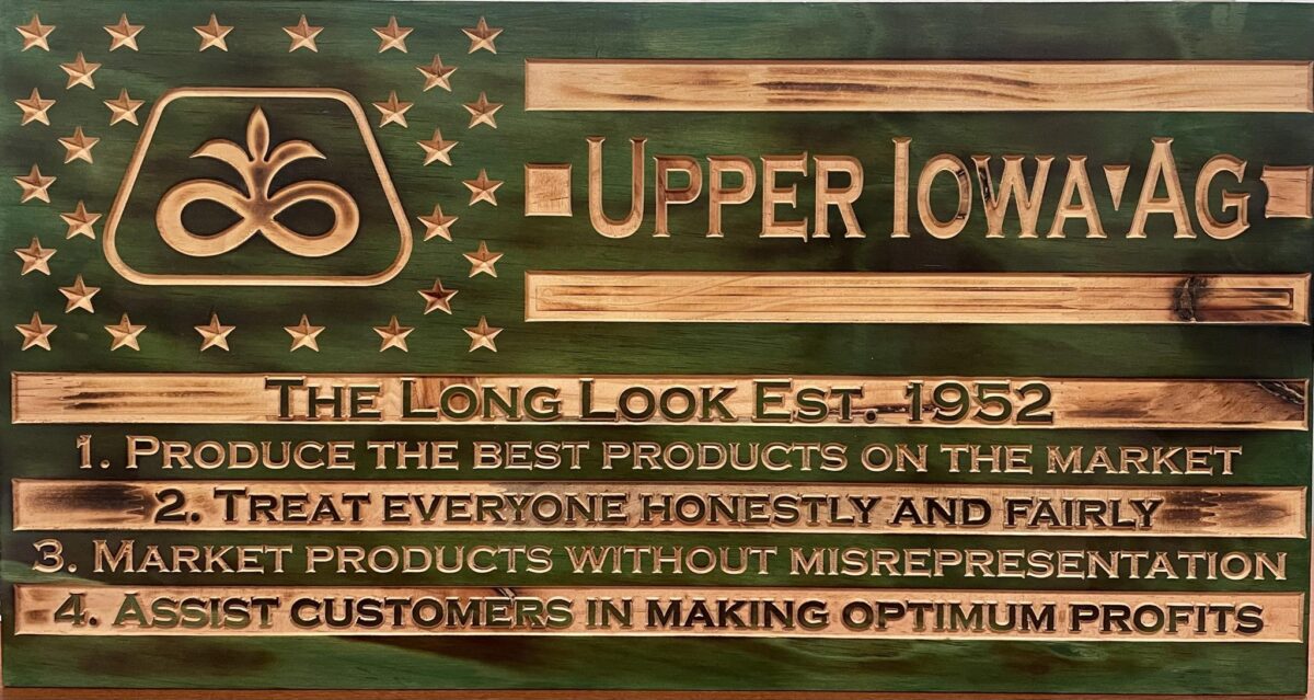 wooden American flag with Upper Iowa Ag logo on top of stars in left upper corner