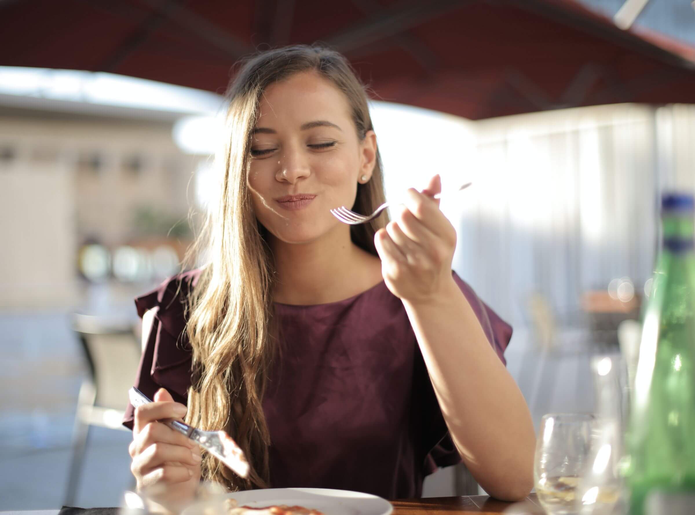 Woman in Purple Eating