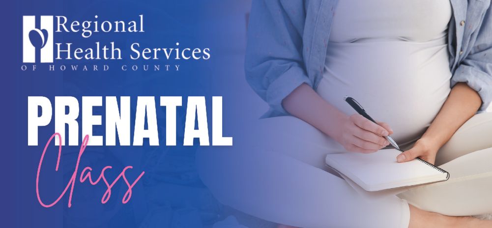 Prenatal class with pregnant woman sitting cross legged writing in a notebook