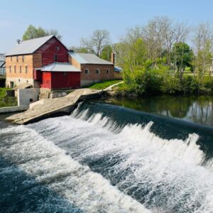 Lidtke Mill in background with Upper Iowa River in foreground