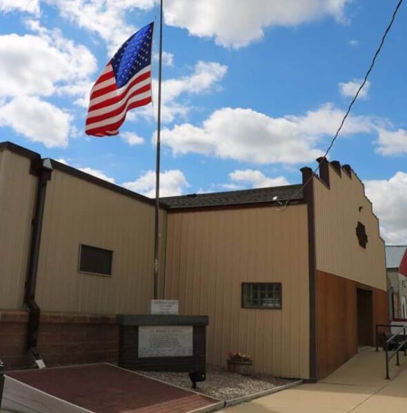Elma Memorial Hall with US flag flying